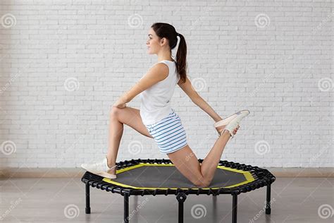 Relaxed Woman Jumping On Trampoline Stock Image Image Of Couch