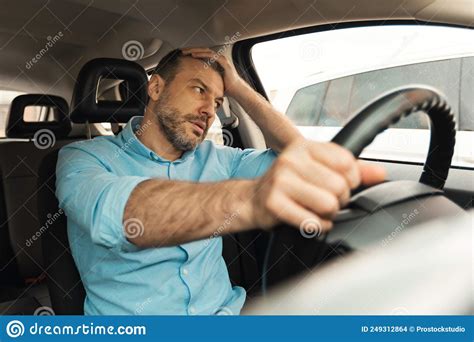 Displeased Driver Man Driving Car Having Problem With Automobile Stock