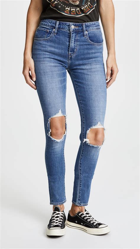 Lyst Levis 721 High Rise Distressed Skinny Jeans In Blue