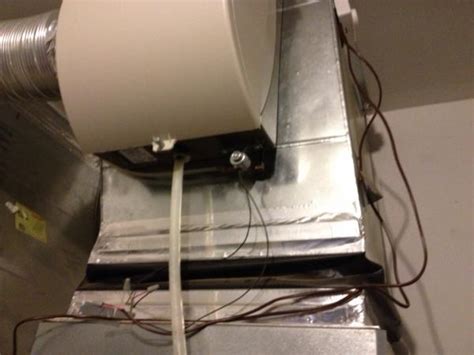 2) the humidifier body is easily removed by pulling down on the plastic locking tab (photo #1) and swinging the cover up and toward you while lifting slightly. Humidifier not working -Honeywell 220 - DoItYourself.com ...