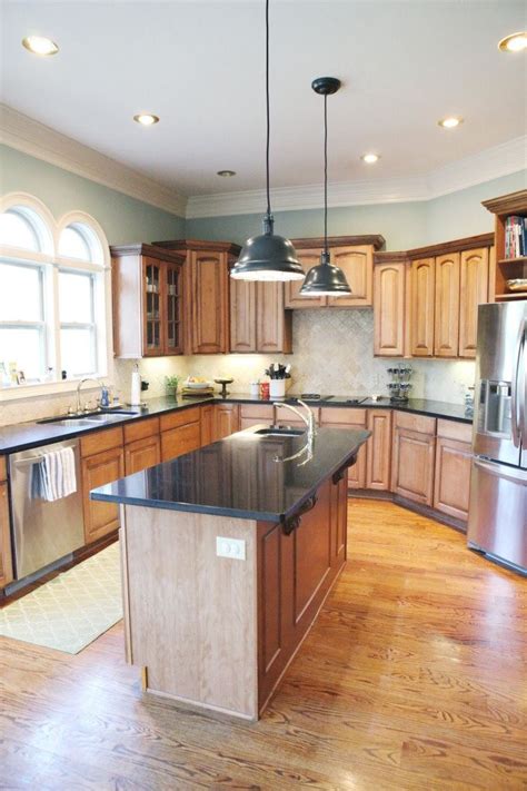 So i have a very dated, ugly kitchen with honey oak cabinets. Kitchen Paint Color - this looks good with wood cabinets ...