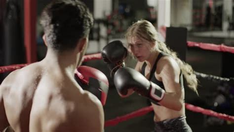 Medium Panning Shot Of Male And Female Boxers Sparring Stock Video Footage Dissolve