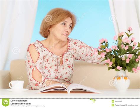 Sometimes women want to be dominant in bed, but sometimes they want their partner to be the one that will take control in the bedroom. Beautiful Older Woman Resting In The Bedroom Stock Photo ...
