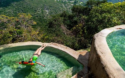 Relax In A Hot Spring Infinity Pool Overlooking Volcanic Mountains