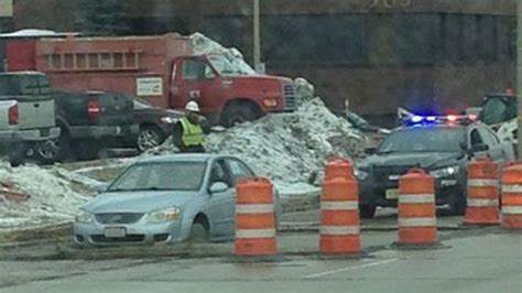 Car Drives Into Freshly Poured Concrete Along Construction Route