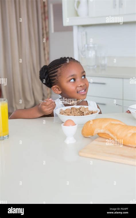 Smiling Beautiful Little Girl Eating Cereals Stock Photo Alamy