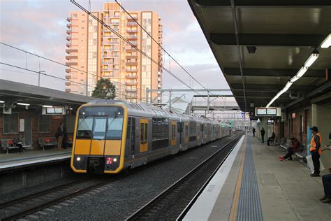 The carriages were of stainless steel, double deck construction. T21 arrives into Granville station with a down service ...