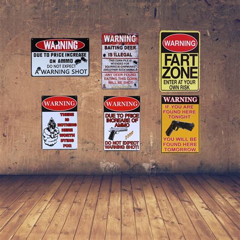 A Warning Shot Tin Metal Signs With Gun Knuckles Weapon Baiting Deer Is