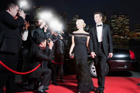 Celebrities Posing For Paparazzi On Red Carpet Stock Photo And More