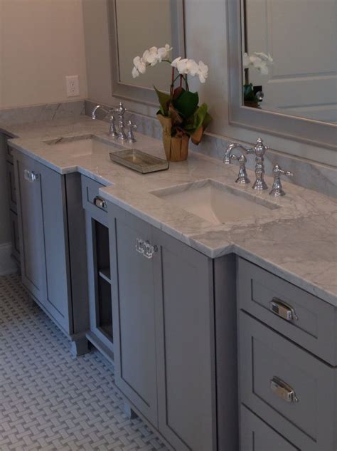 We work primarily with property development groups, home builders and remodelers, contractors and our cabinet inventory will meet your cabinetry needs. Kraftmaid pebble gray, Carrara marble | Kraftmaid kitchen cabinets, Kraftmaid cabinets ...