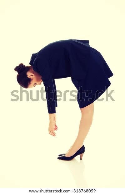 Young Business Woman Bending Down Looking Stock Photo 318768059