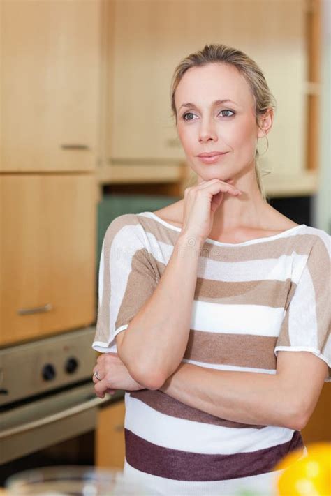 woman in thoughts standing in kitchen stock image image of mind caucasian 22661179
