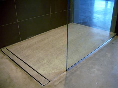 Modern Open Concept Bathroom Featuring A Concrete Floor A Curbless