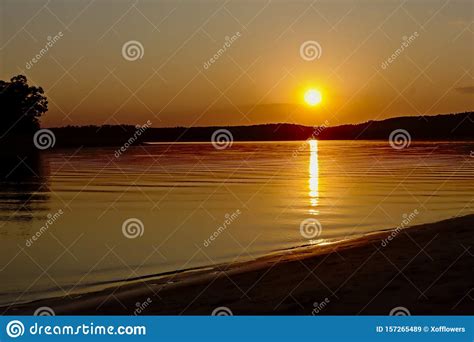 Warm Orange Sunset Sky Over Montargil Lake Portugal Stock Image