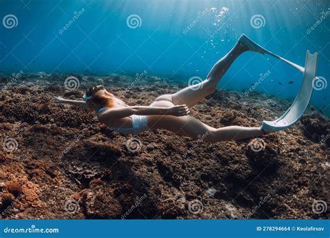 Woman Freediver Glide With Fins Underwater Over Corals Freediving In