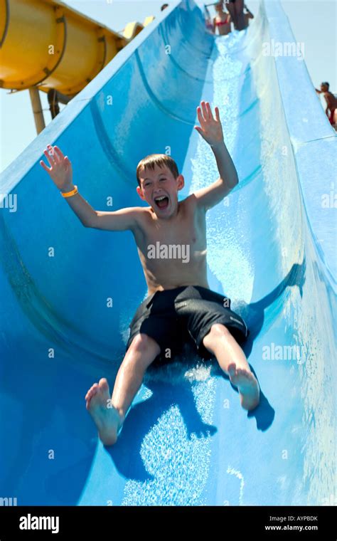 Young Teen Boy On Water Slide Stock Photo Alamy