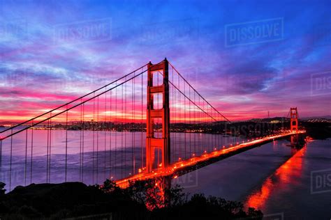 Golden Gate Bridge Lit Up At Sunset San Francisco California United