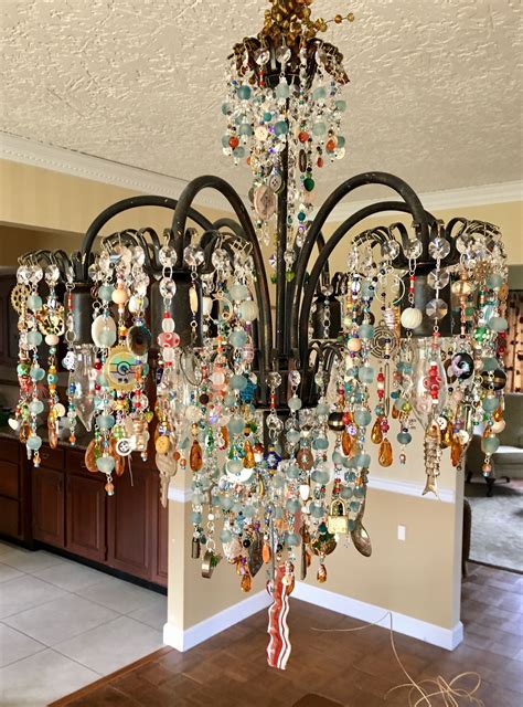 Upcycled Chandelier With Found Objects Shells Watches Fishing Lures