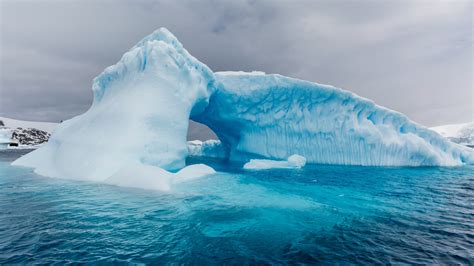 Archway Formed In A Glacial Iceberg At Cierva Cove Antarctica