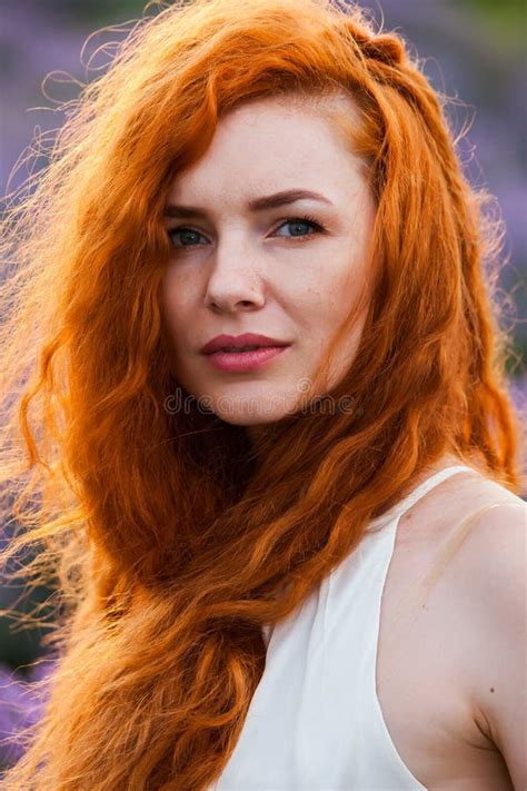 Summer Portrait Of A Beautiful Girl With Long Curly Red Hair Stock