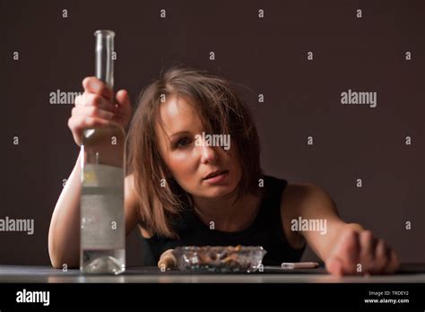Portrait Of A Depressed Drunken Woman With A Bottle Of Wine In Her Hand Stock Photo Alamy