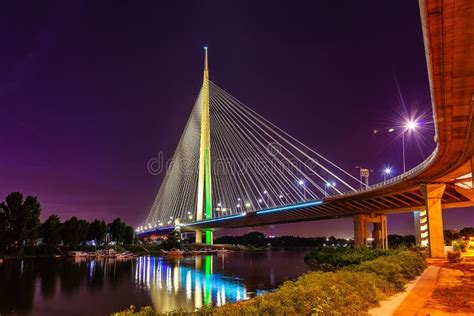 Side View Of Ada Bridge At Night With Reflection Over Belgrade Marina