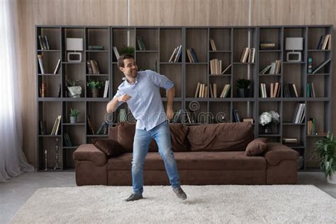 Happy Young Man Dance In Living Room At Home Stock Photo Image Of