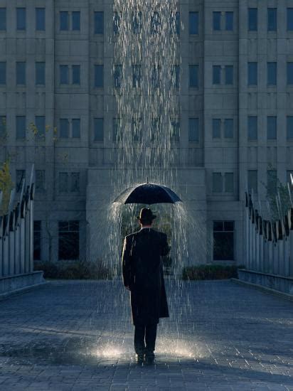 Man With Umbrella Under A Regional Rain Photographic Print By Joseph