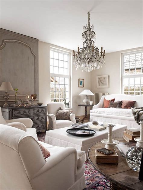 For a true french country farmhouse look that still feels bright and modern, spruce up your living room with antique furniture in soft colors. French farmhouse living room, chandelier | Fab French ...