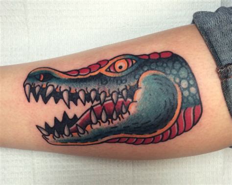 Mar 01, 2017 · black ink alligator tattoo design for sleeve. Traditional crocodile head tattoo by Matt Nemeth in RVA ...