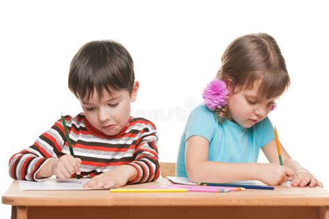 Two Children Write At The Desk Stock Image Image Of Child Adorable