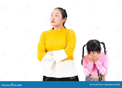 The Image Of An Asian Mother And Daughter Being Angry In A White