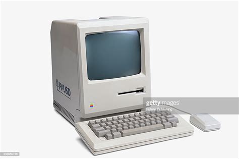 A Vintage 1980s Apple Macintosh Personal Computer With Keyboard And