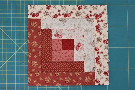 Our log cabin block has a center square surrounded by five 'rounds' of logs. Two Tone Log Cabin Quilt Block | FaveQuilts.com