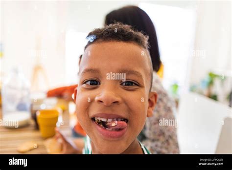 Happy Boy Eating Breakfast At Home Stock Photo Alamy