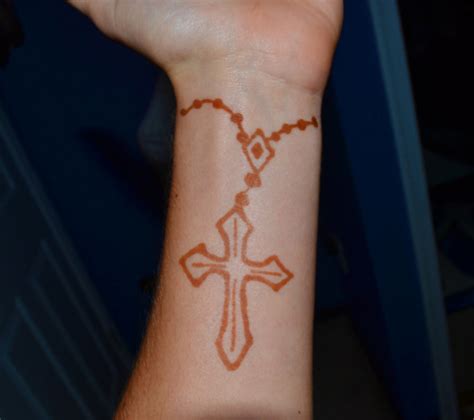 Rosaries are usually coupled with cross and they can be perfect tattoos to represent your spiritual tendency. Wrist rosary beads cross tattoo idea