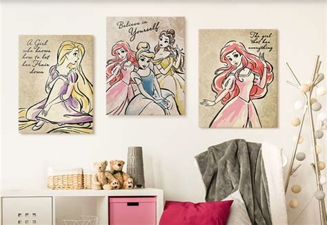 Three Disney Princesses Are Hanging On The Wall Next To A Pink Chest