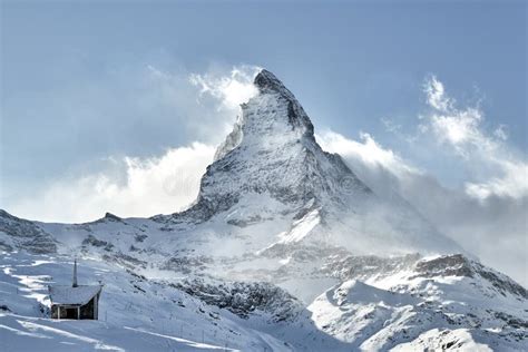 Summit Of Matterhorn Mountain Covered By Clouds Coloured Red Stock
