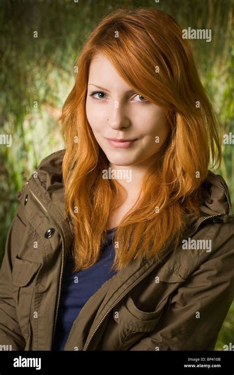 beautiful redhead teen posing for the camera with a cute free nude porn photos