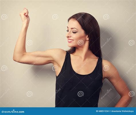 Strong Fitness Young Woman Showing Muscle Bicep With Happy Smiling