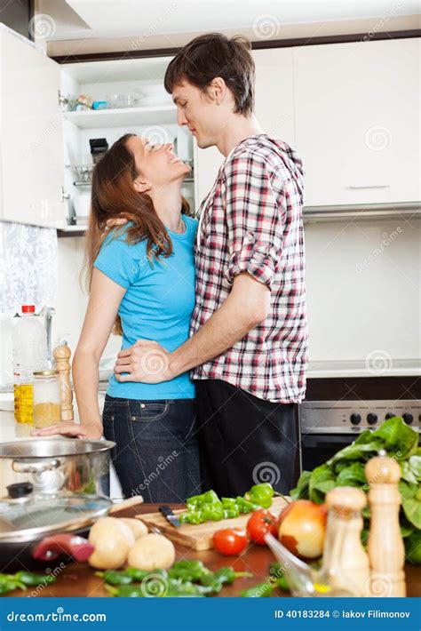 Couple Having Flirt At Kitchen Stock Photo Image Of Lovers Kissing