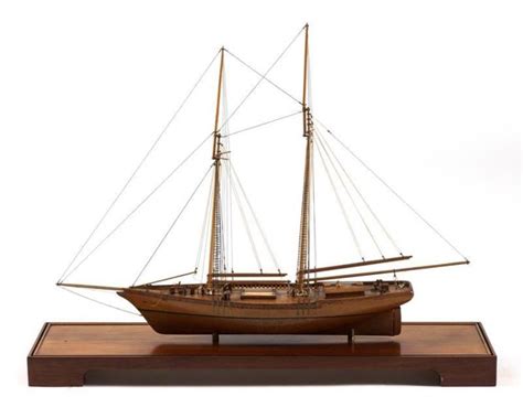Lot Cased Model Of A Two Masted Schooner Hull With Natural Finish And