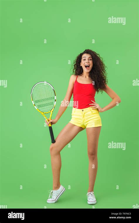 Image Of Joyful Female Tennis Player 20s Smiling And Holding Racket