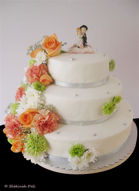 3 tier with cascading flowers. Shekinah Deli: Wedding cake with cascading flowers