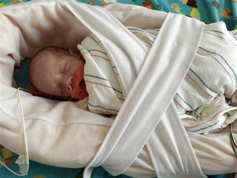 How to soothe crying babies with swaddling and white noise
