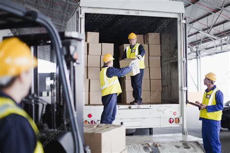 Workers Unloading Boxes From Truck Stock Image F0043532 Science Photo Library