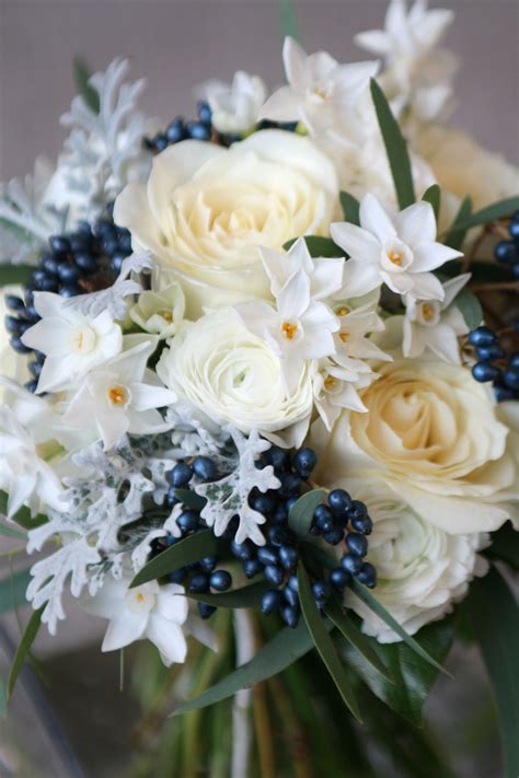 I'm kicking off the new year with a new year's eve inspired wedding party palette made up of midnight blue, silver & gold. Winter wedding bouquet in white and midnight blue. Roses ...