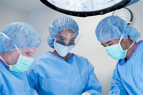 Doctors Performing Operation Stock Image F020 5293 Science Photo