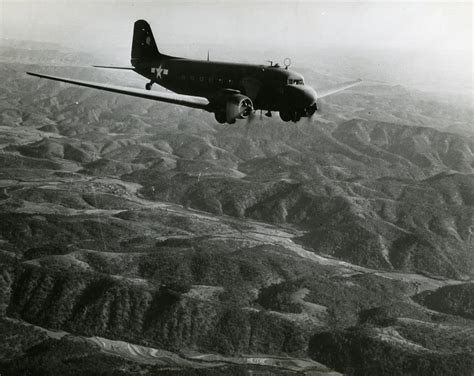 Douglas C 47 Skytrain In Flight Over Mountainous Terrain Burma The