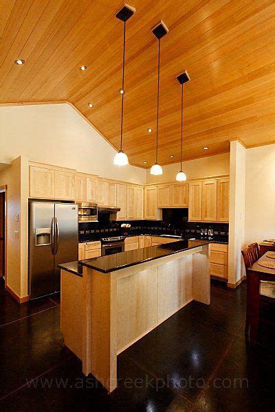 That everything shows on it.dust, fingerprints, etc. Maple cabinets with black granite countertops. Very ...